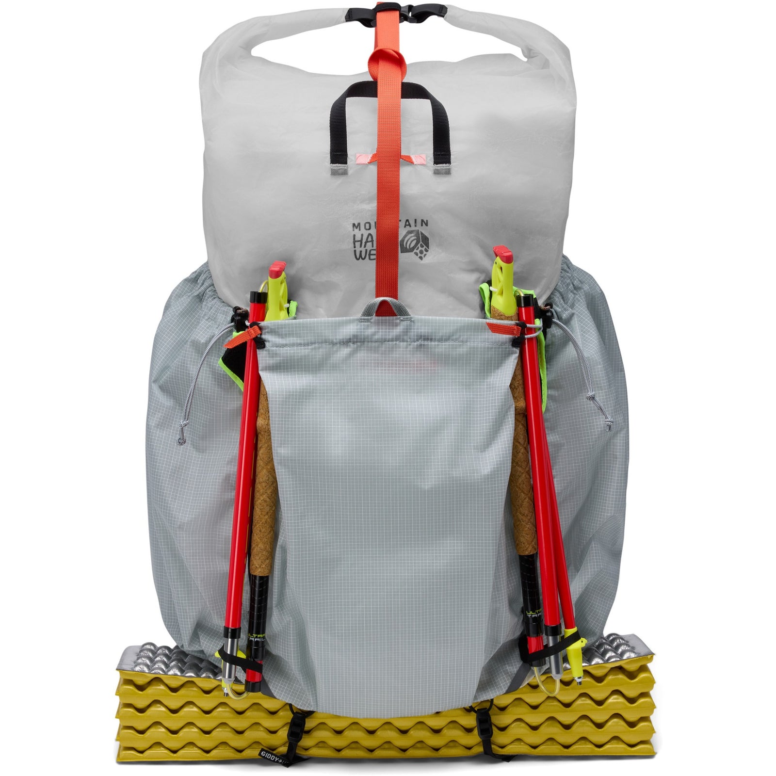 Gray hiking backpack with attached trekking poles on a white background