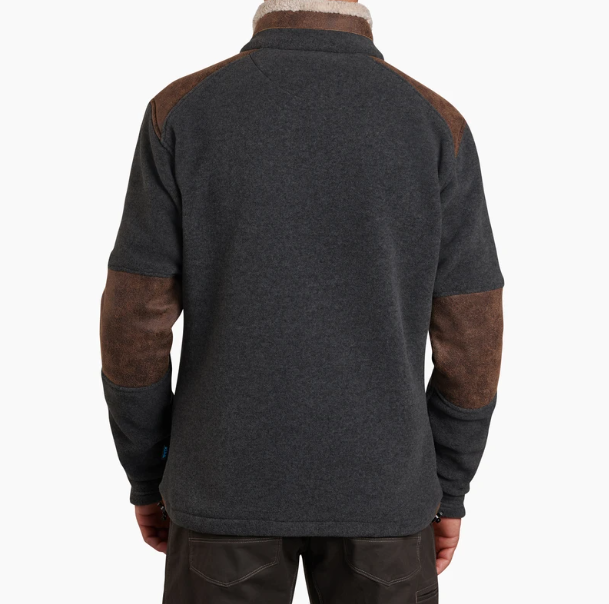 a model wearing the kuhl alpenwurx jacket in steel, back view