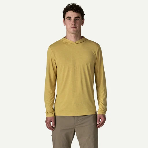 Man wearing a yellow long-sleeve hoodie on a white background