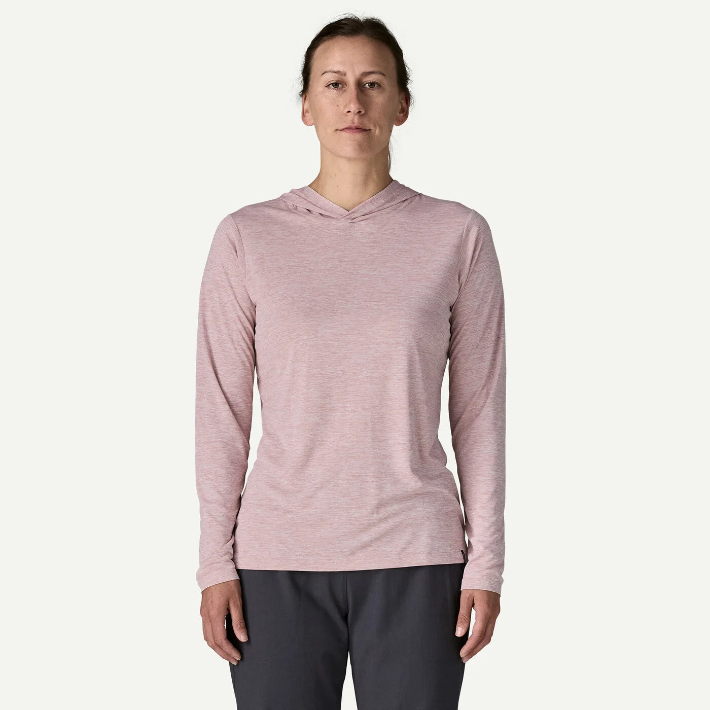 Person wearing a pink long-sleeve hoodie on a white background