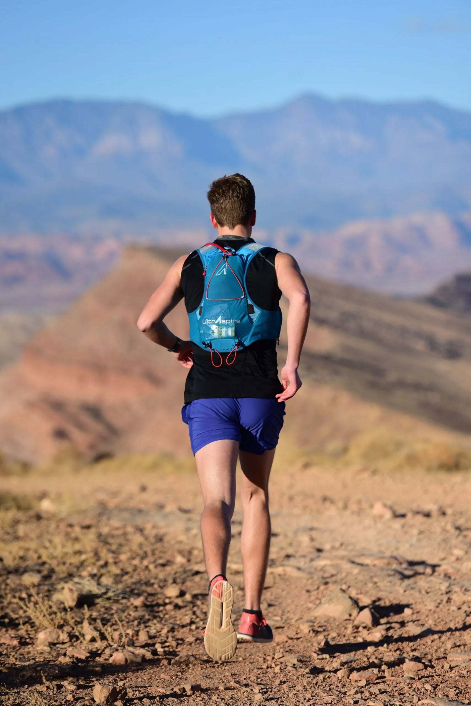 man running with pack