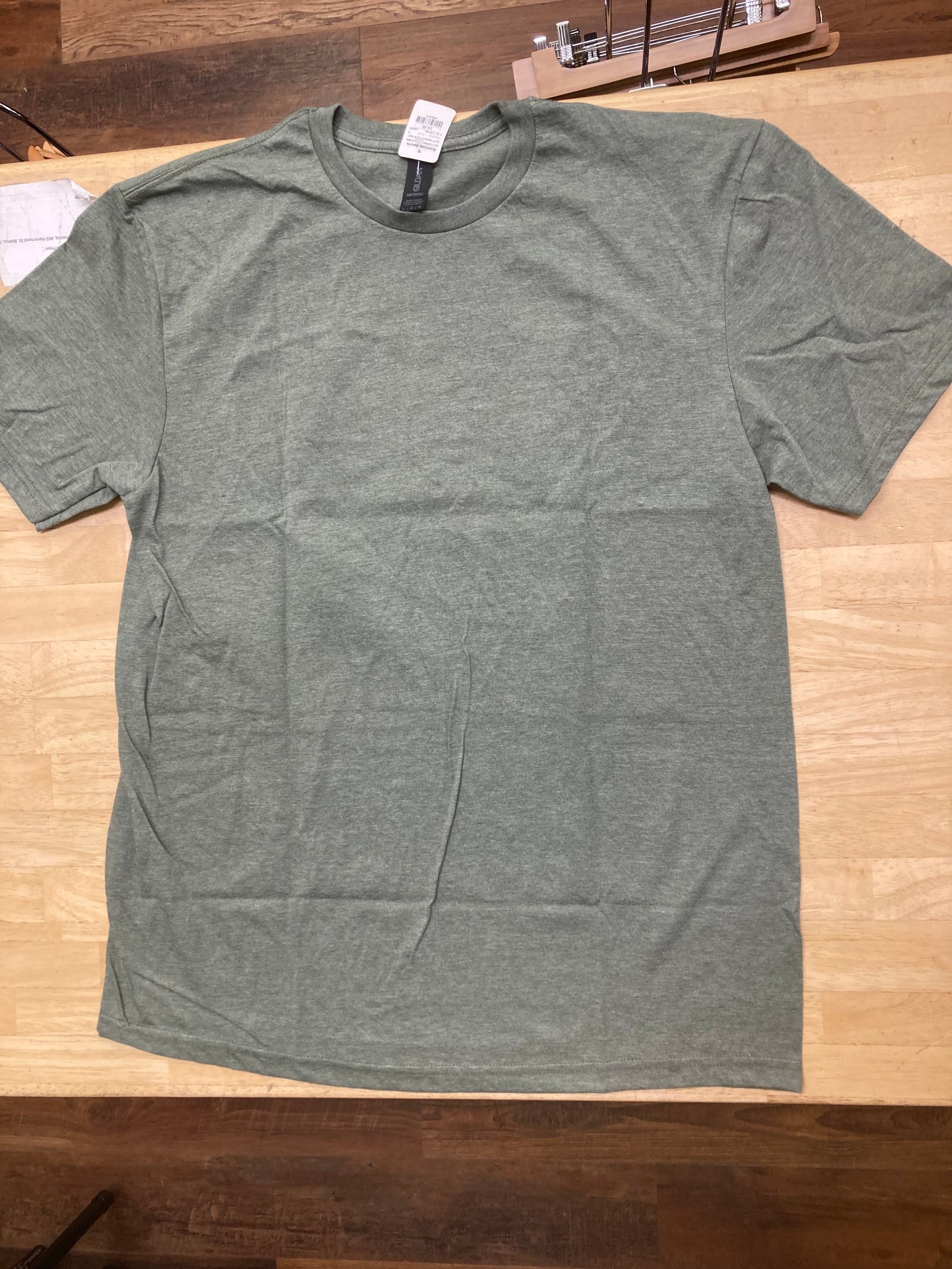 front of the buttermilk rd tee shirt in green heather
