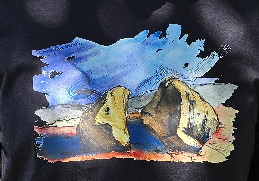 Artistic depiction of two boulders on a black background with 'Chalk Fox Studio' branding.
