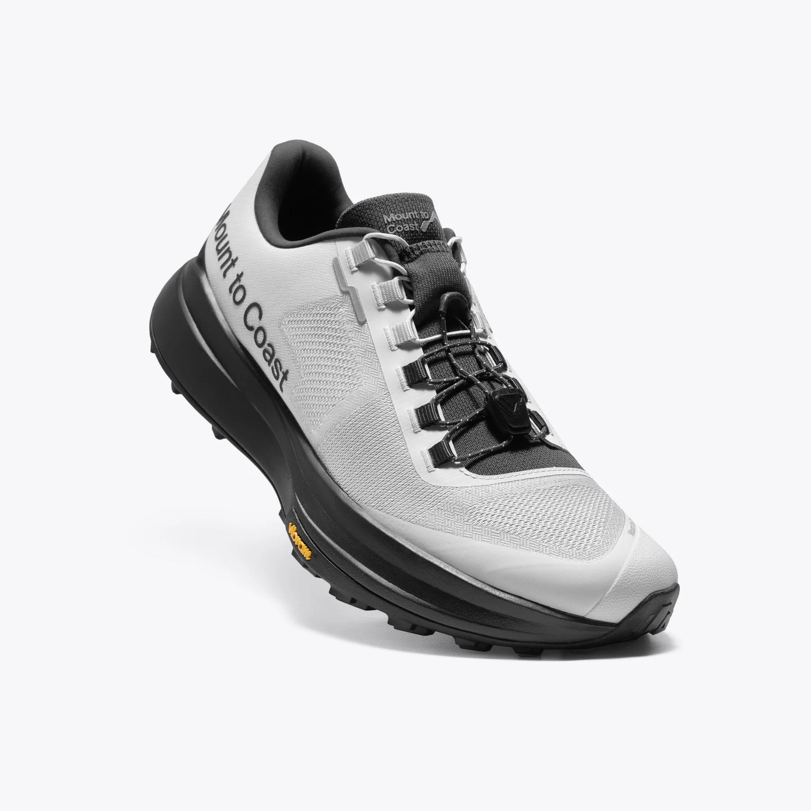 White and black hiking shoe with 'Mount to Coast' branding on a white background