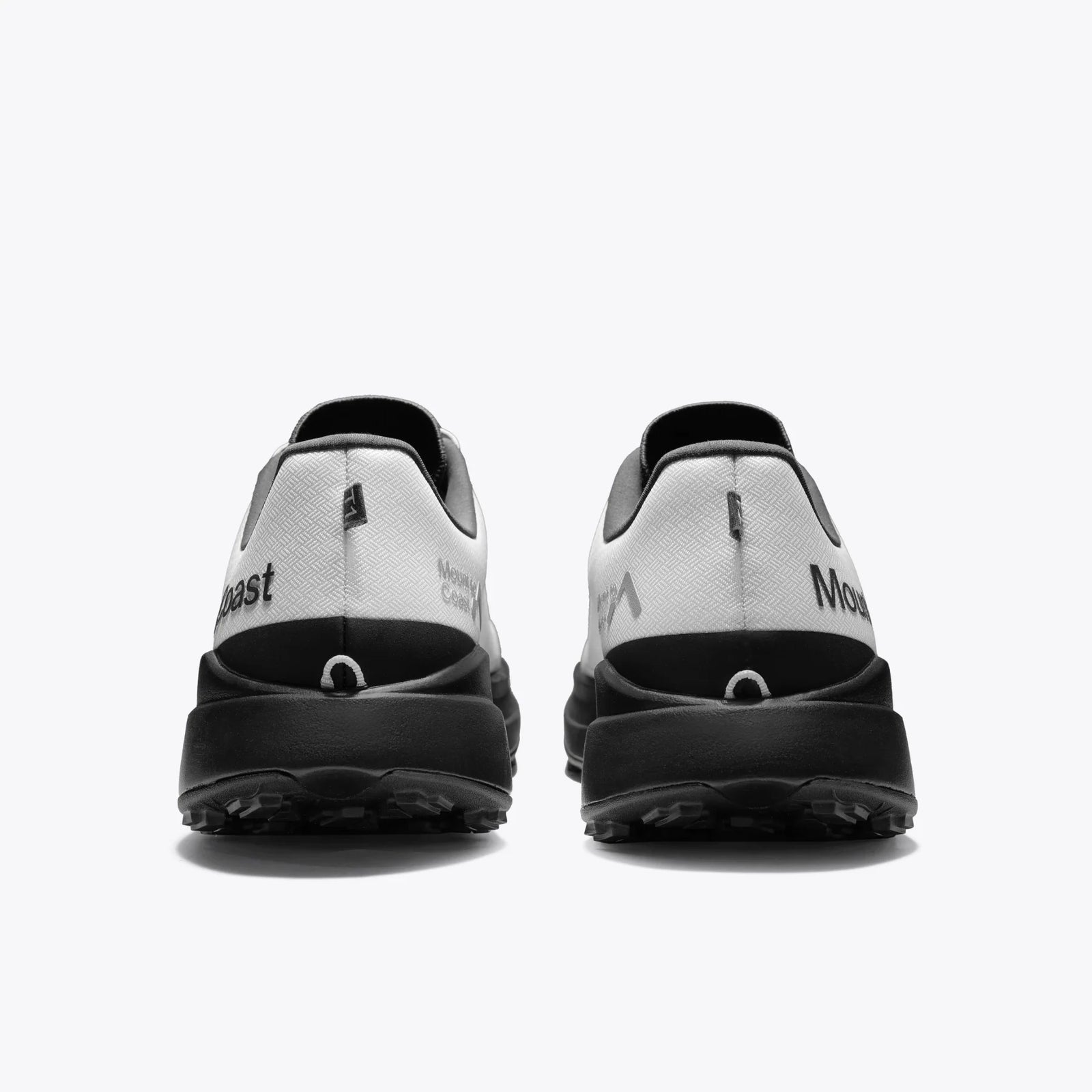 Pair of black and white shoes on a white background