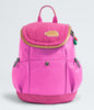 Pink backpack with a plush top section on a light gray background