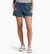 a model wearing the kuhl vantage four inch shorts in the color metal blue, front view