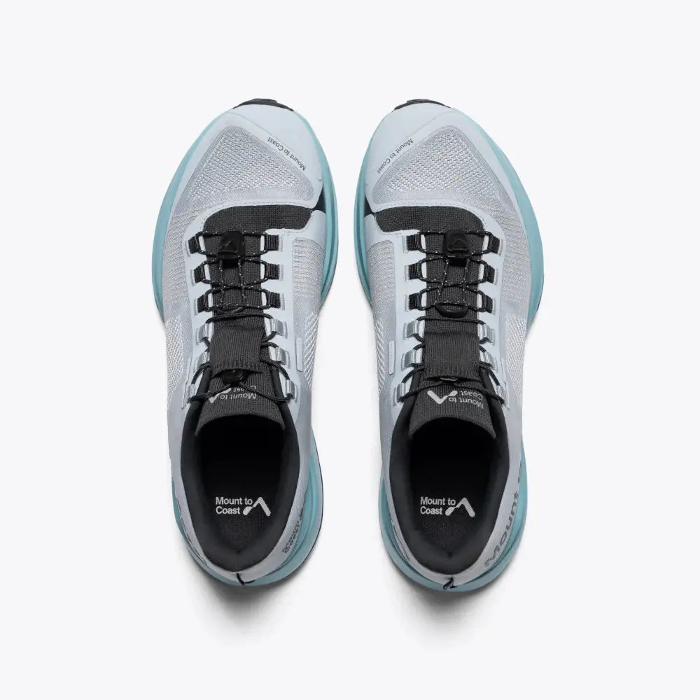 Pair of gray and black athletic shoes on a white background