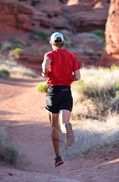 the ultraspire fitted race 2.0 on a runner rear view