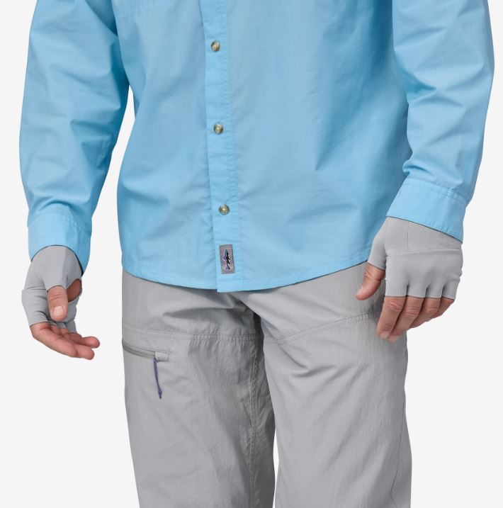 a model wearing the patagonia sun gloves in the color salt grey