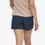 rear view of the patagonia womens 5" baggies shorts on a model in the color tidepool blue