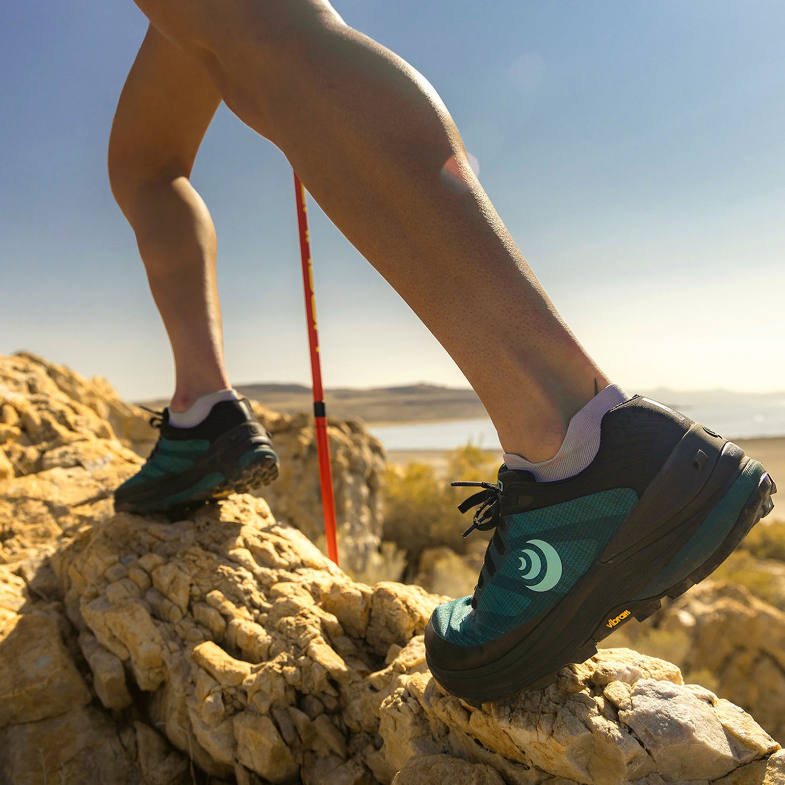 a model cavorts on some rocks while wearing the ultraventure pro