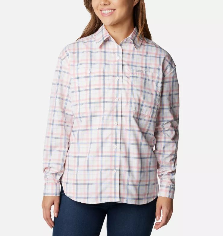 a model wearing the columbia womens silver ridge utility patterned long sleeve shirt in the color white small plaid, front view