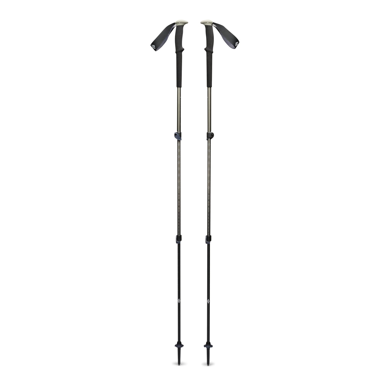 Two green-black hiking poles on a white background
