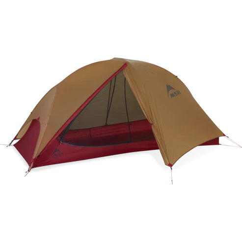 Brown and red tent with a visible brand logo on a white background