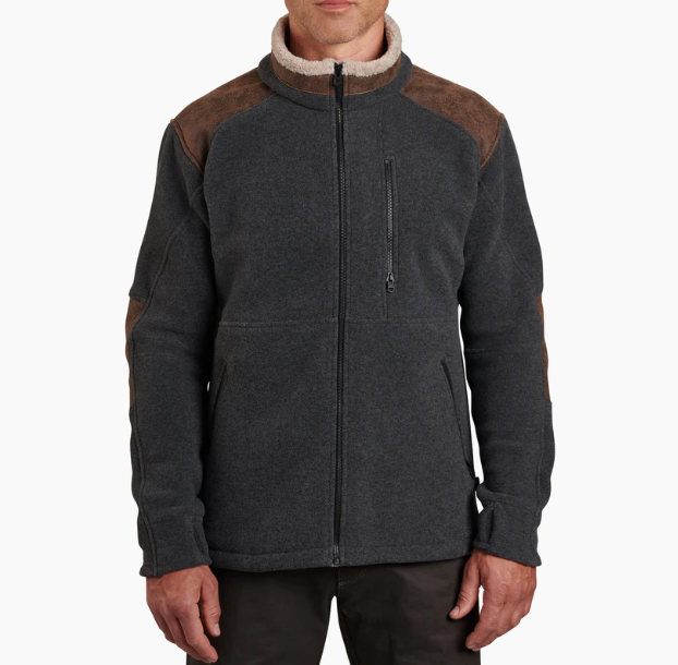 a model wearing the kuhl alpenwurx jacket in steel, front view