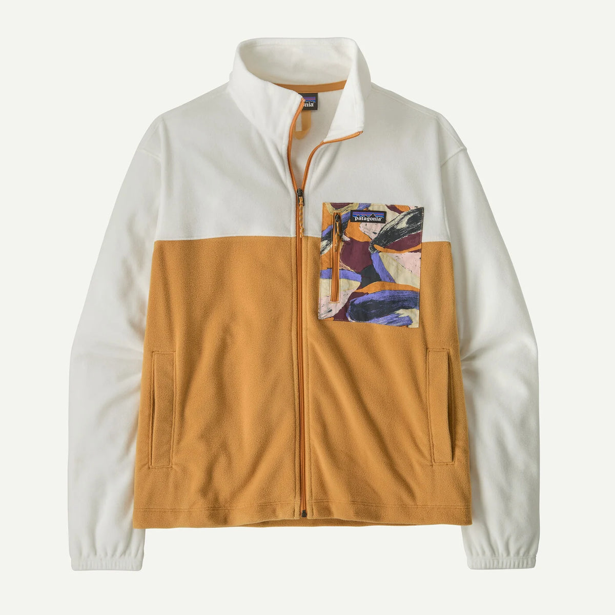 A Patagonia fleece jacket with a colorblock design, featuring an off-white upper section and sleeves, a mustard yellow lower body, and a colorful abstract art print pocket on the left chest.