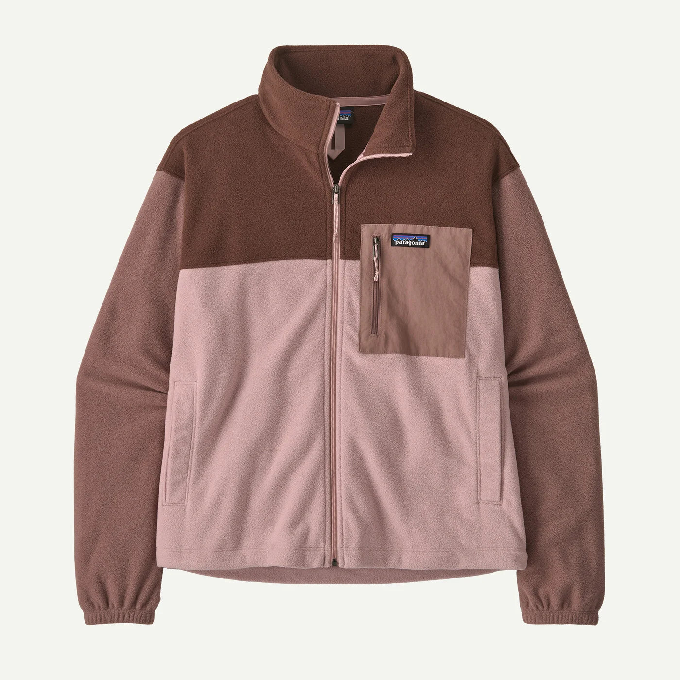 A Patagonia colorblock fleece jacket with a brown upper section and sleeves, a dusty pink lower body, and a brown chest pocket with a zippered pocket on the front.