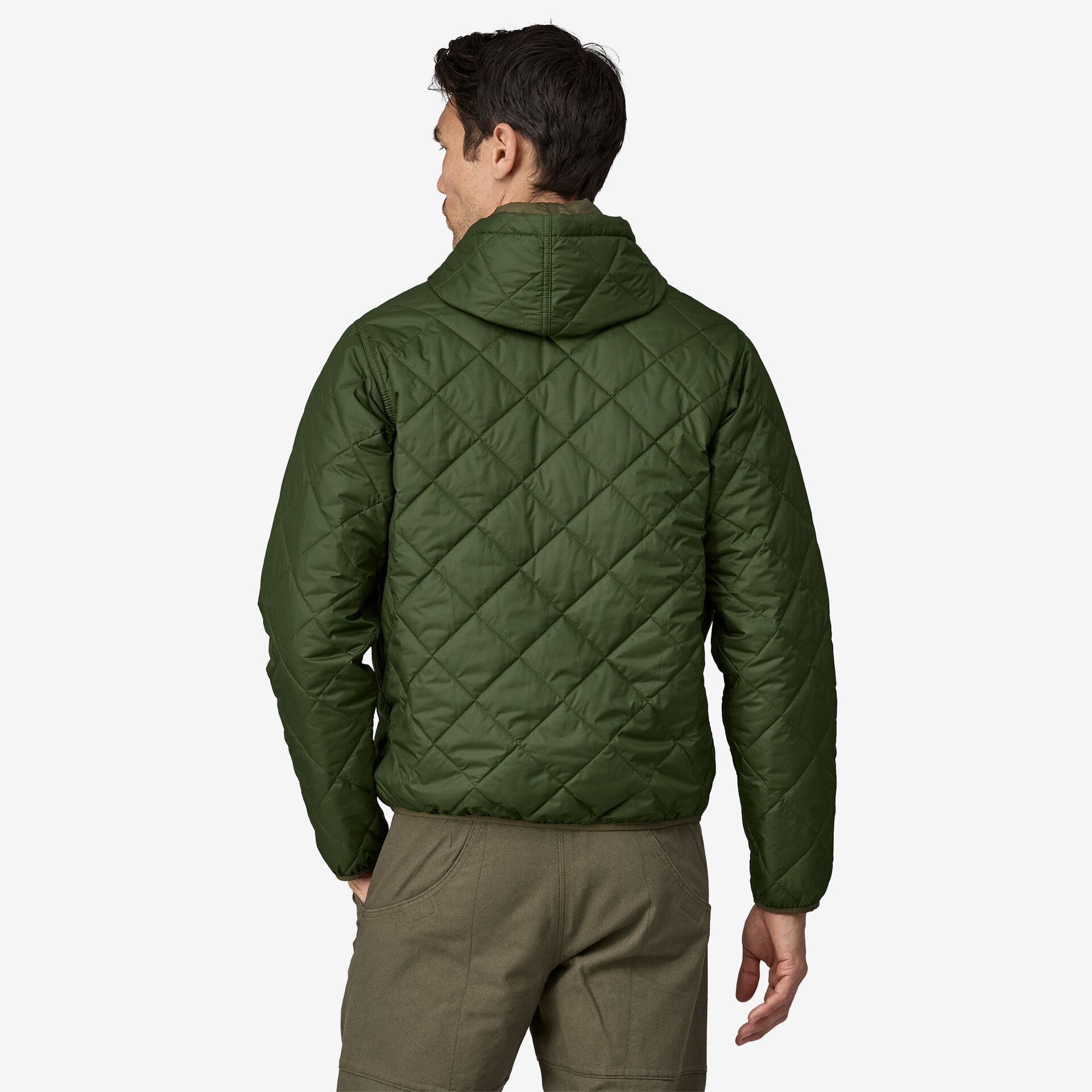 the diamond quilted bomber hoody in torrey pine green from the back on model