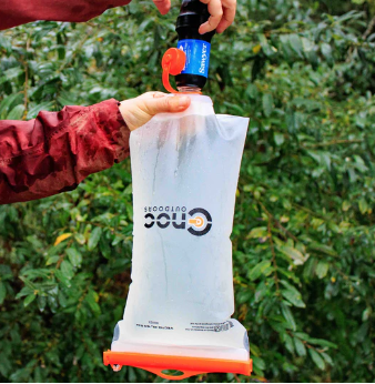 cnoc 2l 28mm orange bladder being used with a filter