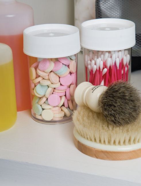 some of the nalgene 8oz storage jars filled with various bathroom things