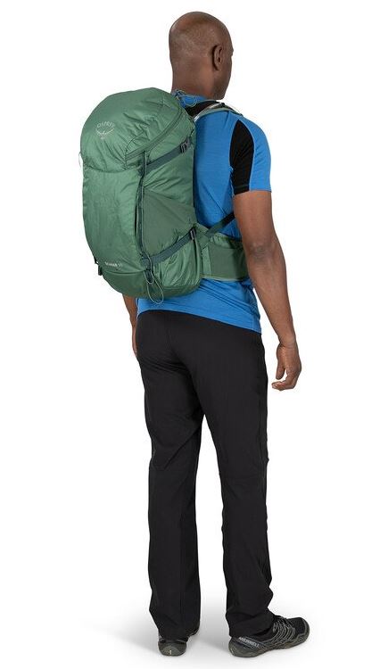 a photo of the osprey skarab 30 liter pack in the color tundra green, back view on a model
