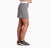 a photo of a model wearing the kuhl freeflex skort in the color flint, side view