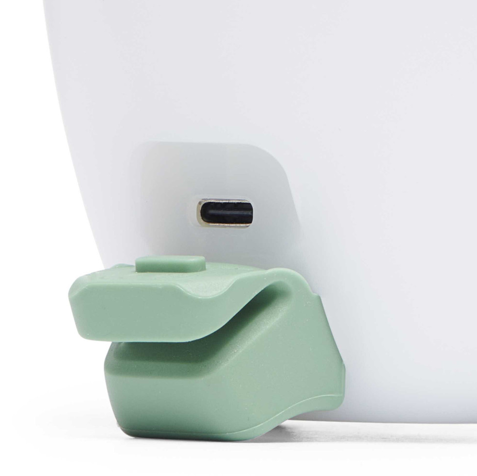 Black diamond orbiter 450 headlamp in the color sage, detail view showing the usb c port