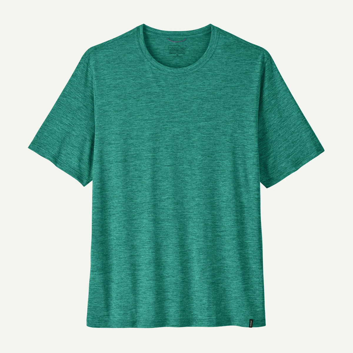 Green t-shirt on a light gray background
