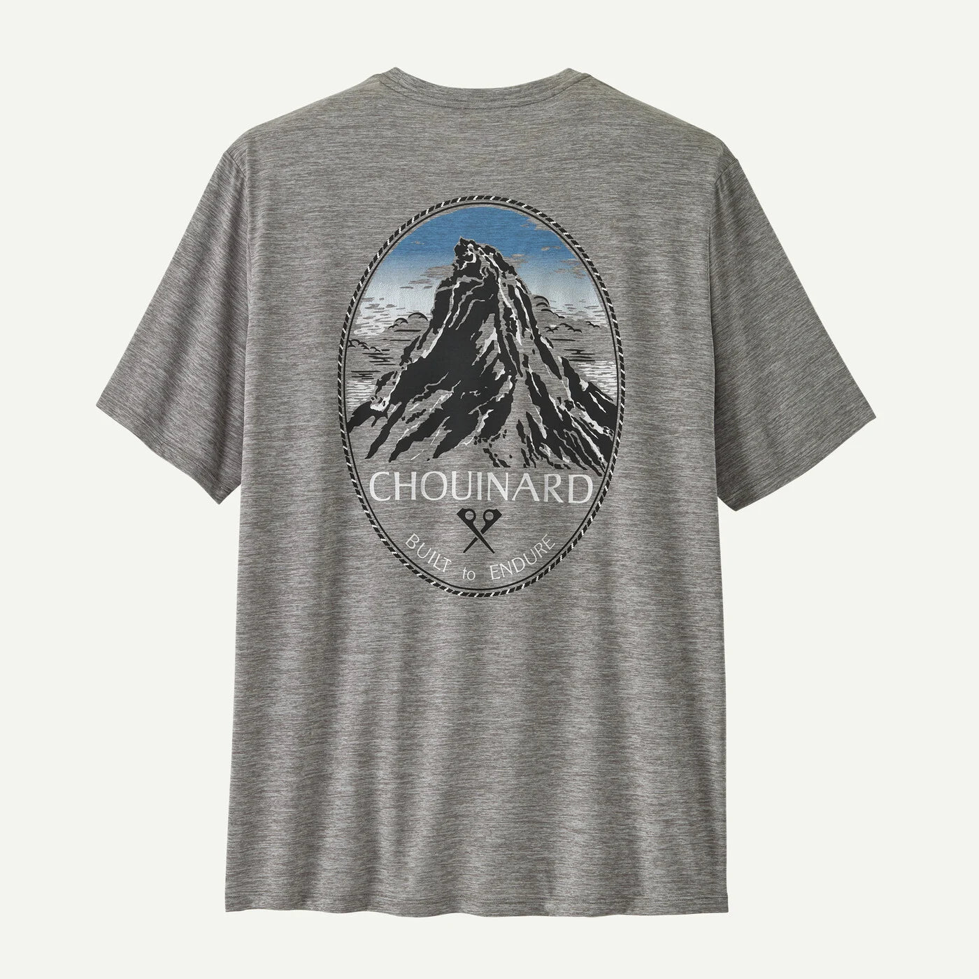 Gray t-shirt with mountain graphic and 'Chouinard' branding on a white background