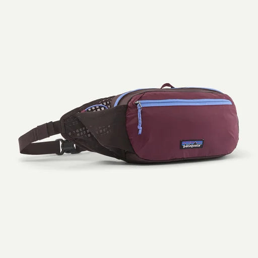 purple fanny pack, with patagonia logo, blue zippers and dark brown belt