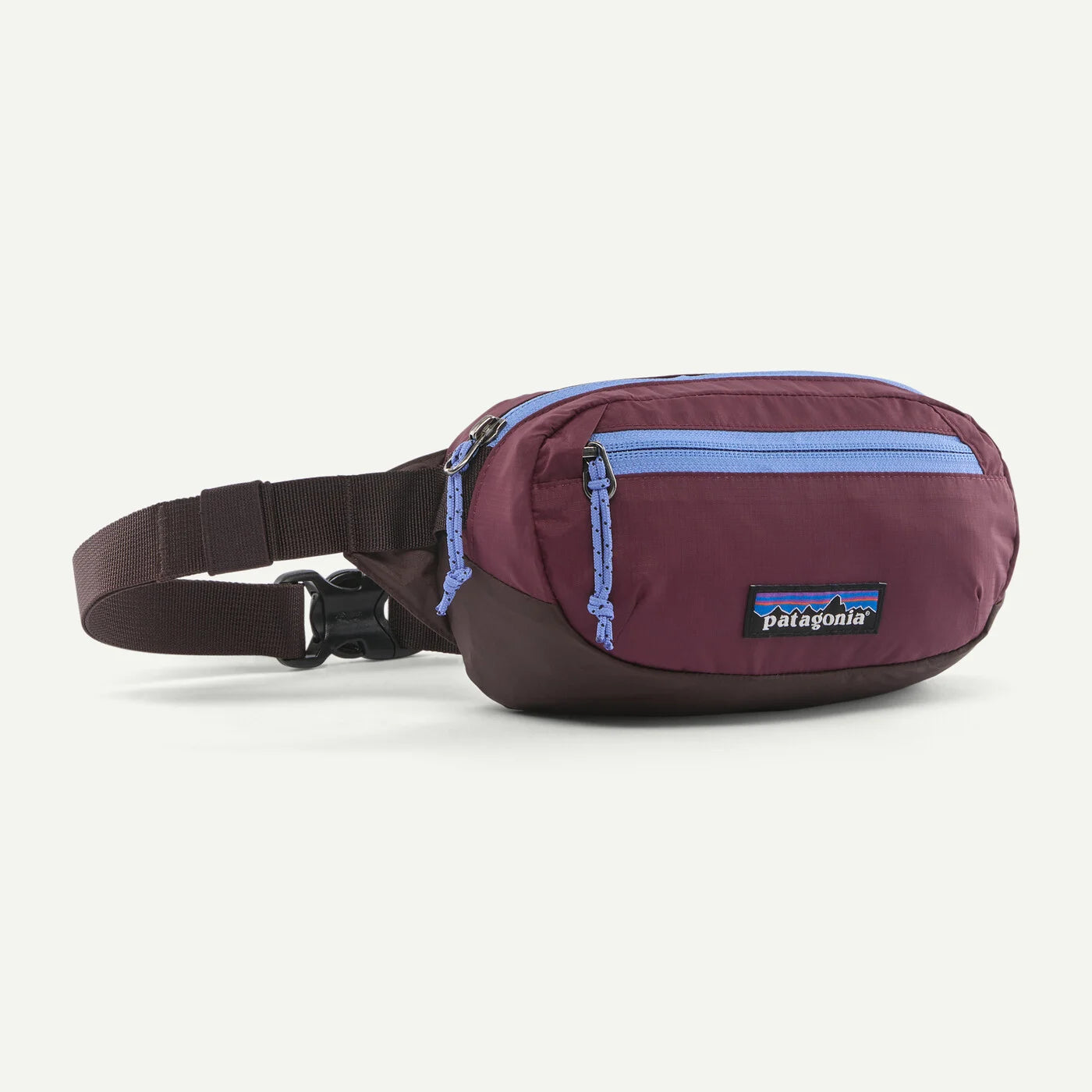 A Patagonia waist bag in burgundy and dark brown with light blue zipper accents, shown on a clean white background.