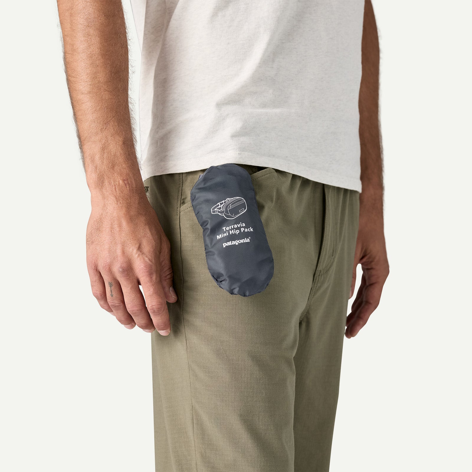 Patagonia Terravia Hip Pack Mini 1L in smolder blue, packed into its own side pouch to save on storage space