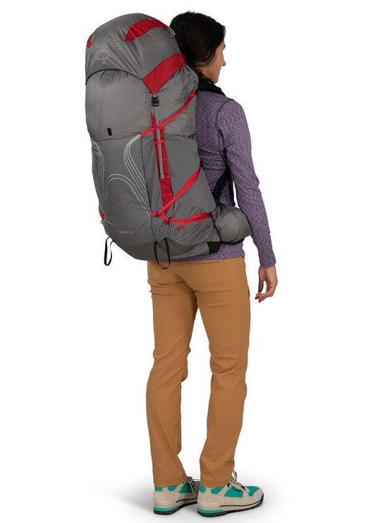a photo of the osprey eja pro 55 backpack in the color dale grey poinsettia red, back view on a model