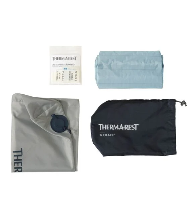 the neoair xtherm nxt sleeping pad shown with all included pieces