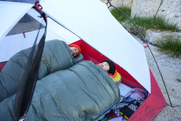 the thermarest neoair xtherm nxt max sleeping pad being used by a model in a tent outside