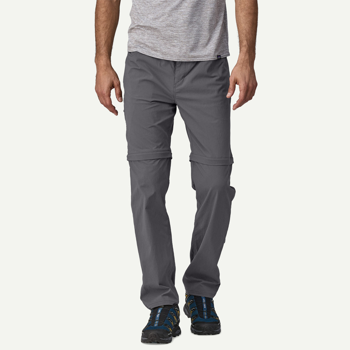 Person wearing gray pants on a white background