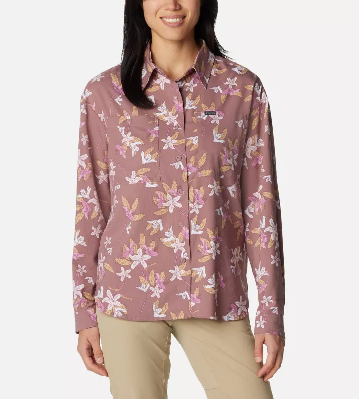 a model wearing the columbia womens silver ridge utility patterned long sleeve shirt in the color fig tiger lilies, front view