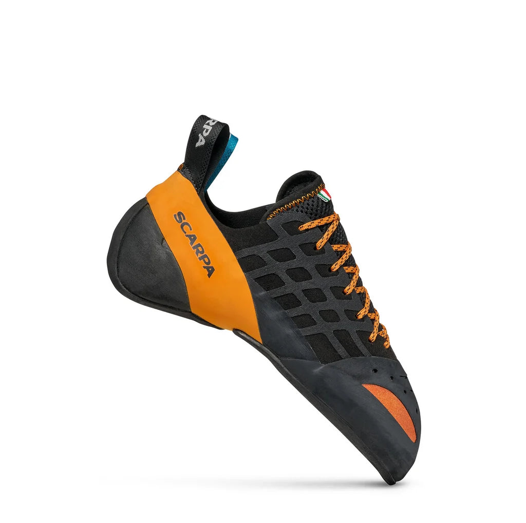 Black and orange climbing shoe with 'Scarpa' branding on a white background