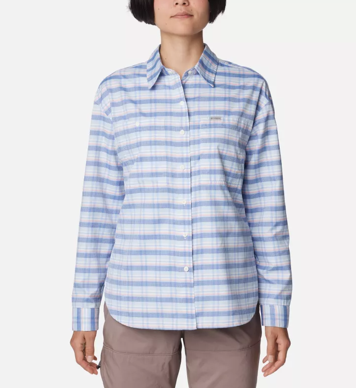 a model wearing the columbia womens silver ridge utility patterned long sleeve shirt in the color eve small plaid, front view