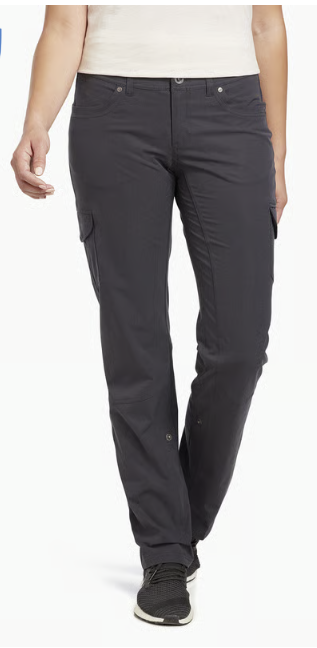 A person wearing dark charcoal cargo pants with a light-colored top and black sneakers, shown from the waist down against a plain white background.