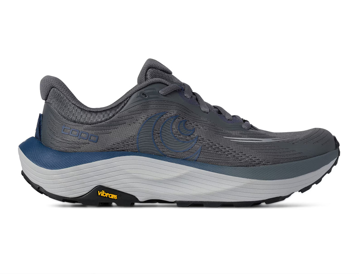 A gray and blue running shoe with a white and gray midsole and a black Vibram outsole, shown from a side profile on a white background.