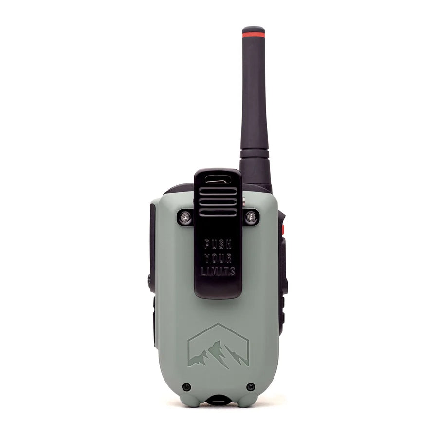 A rugged gray and black walkie-talkie shown from the back, featuring a tall antenna, a black mounting clip with the embossed text 'PUSH YOUR LIMITS,' and a mountain logo near the bottom.