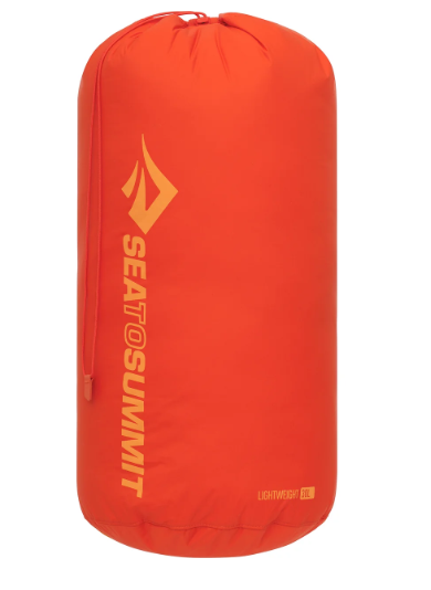An orange Sea to Summit lightweight dry bag or sleeping bag shown upright against a plain white background.