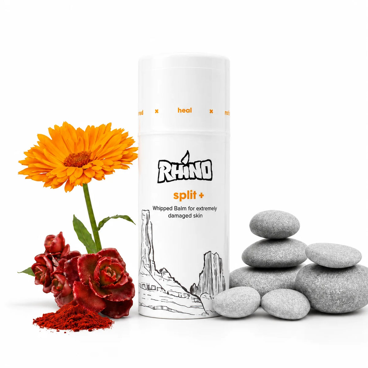 A white cylindrical bottle of RHINO split+ whipped balm for damaged skin, styled with an orange marigold flower, red rose, and gray stones on a white background.