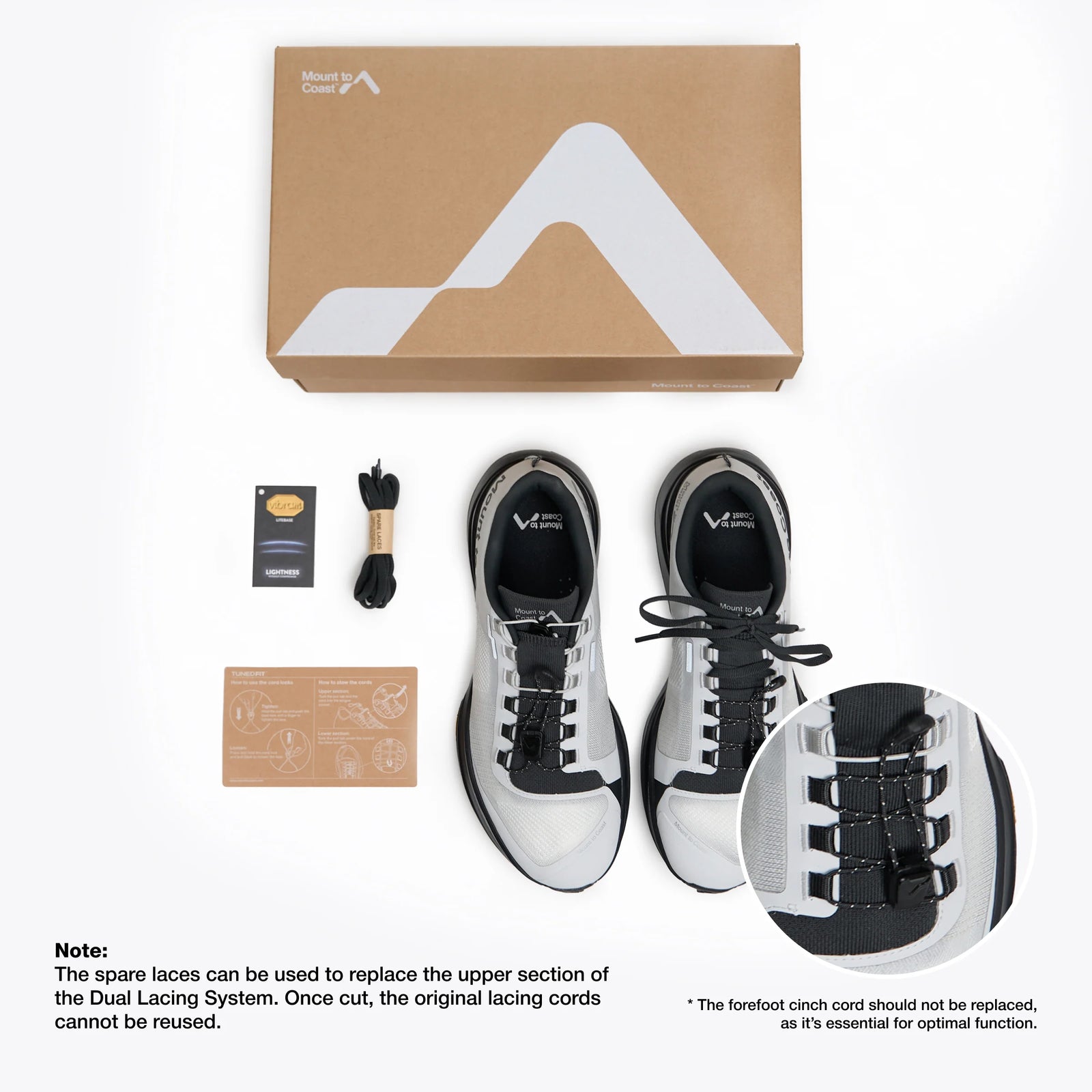 White and black sneakers with packaging and accessories on a white background