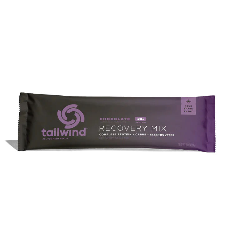 A single Tailwind Recovery Mix chocolate protein powder stick pack on a clean white background.