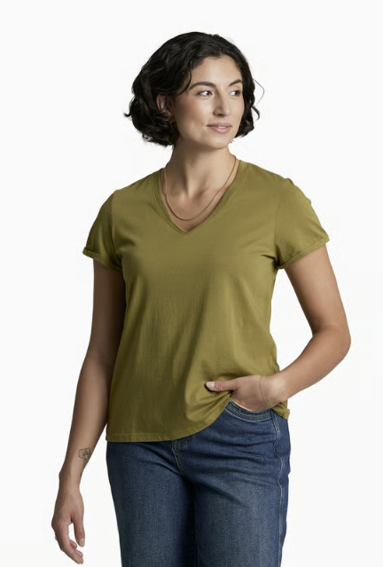 A woman modeling a short-sleeve V-neck t-shirt in olive green, paired with blue jeans, against a plain white studio background.