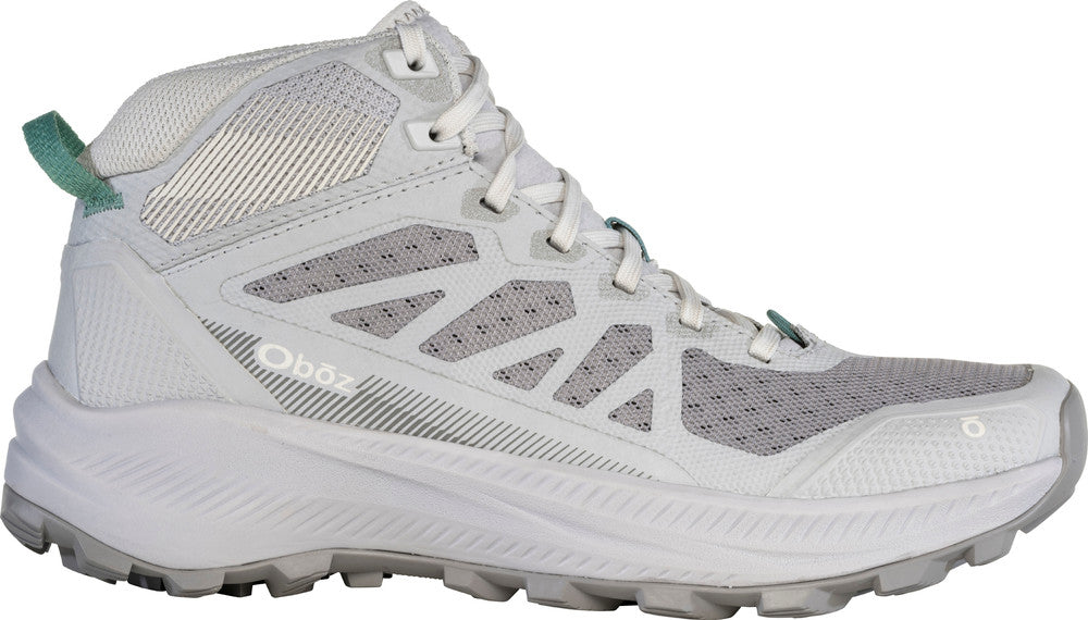 White hiking boot with green accents on a white background