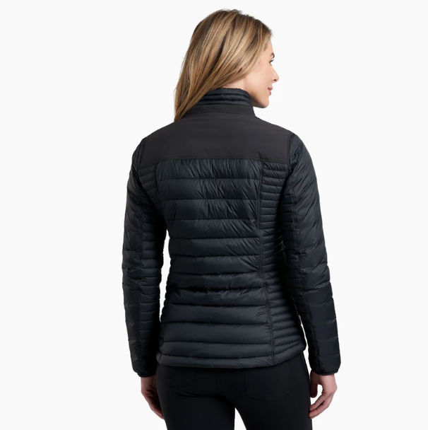 a model wearing the kuhl womens spyfire jacket in the color blackout, back view